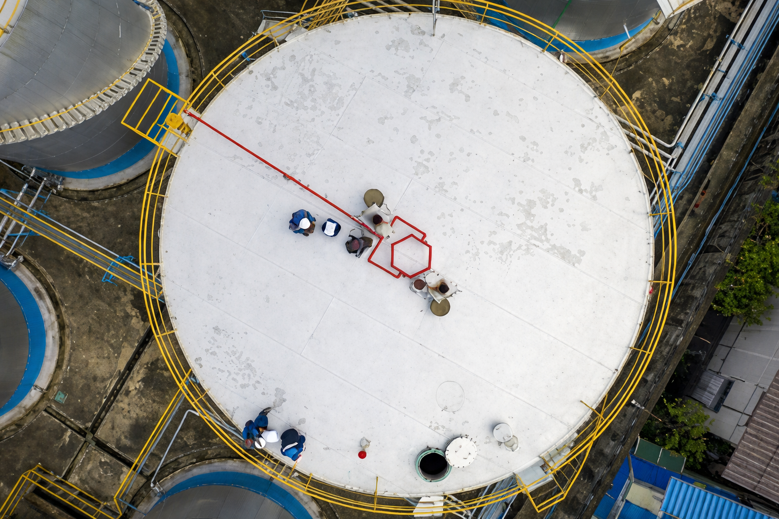 Industrial tank and workers from above